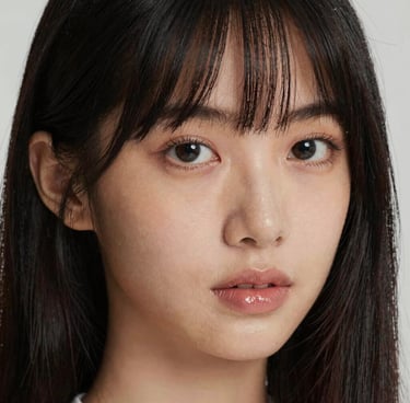 Elegant party decoration with pastel balloons and floral arrangements in a cozy living room.