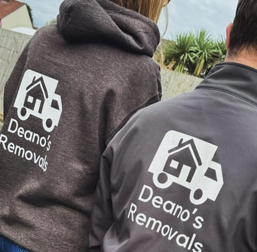 2 deanos removals workers wearing grey company jumpers with their logo