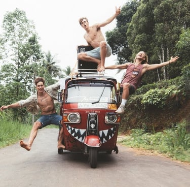 three men are riding in a tuk tuk tuk