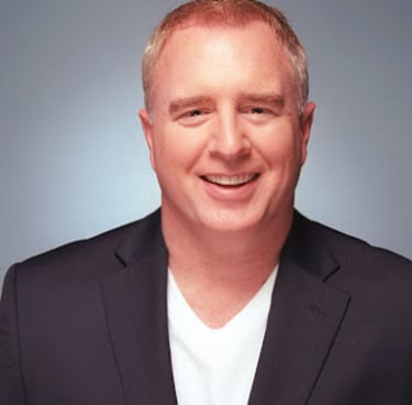 A headshot of Tim Ray. 