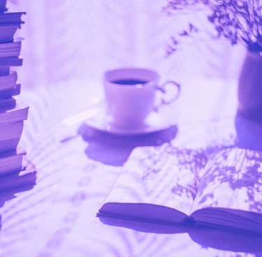 a book and a cup of coffee on a table
