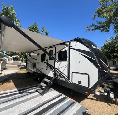 heartland sundance travel trailer at campsite