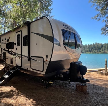 beautiful trailer in front of sly park lake