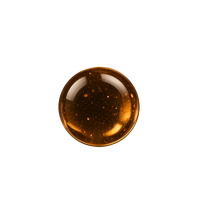 A single golden liquid drop of cosmetic facial oil with bubbles isolated on a black background.