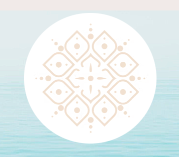 Symmetrical beige mandala flower logo inside a white circle over a blurry blue water background.