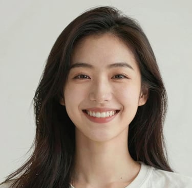 A happy person sitting at a desk, smiling while using a laptop with coaching tools on screen.