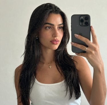 A cheerful child happily coloring with crayons at a bright, colorful table.