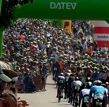 James Oswald Coaching Solar Hill crowded cheering section at a DATEV Challenge Roth triathlon event.