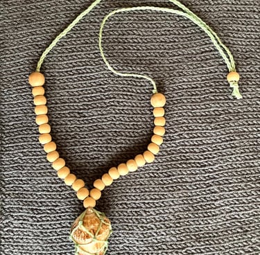 A necklace made by hand from a sea shell
