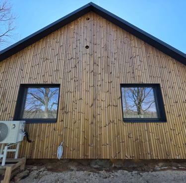 a house with a wooden siding and a window