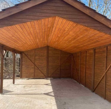 a wooden structure with a wooden roof and a wooden roof