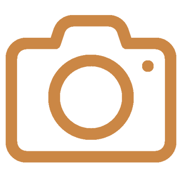 A brown DSLR camera line icon representing photography, media, or digital imaging.