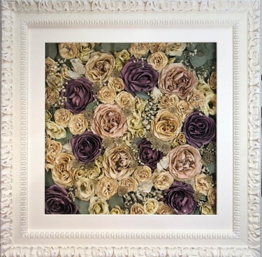 a Flower Wall Style bouquet of flowers in an ornate white frame