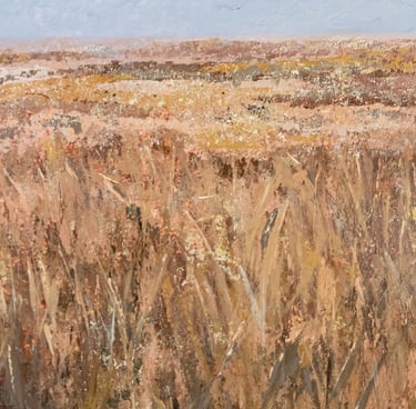 Close-up of textured acrylic painting with soft brown grasses and sparse dark plants under a pale blue sky.