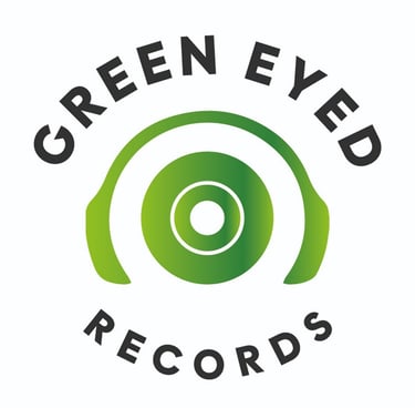 a green eyed record player with headphones on