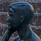 A smiling client shaking hands with an AMWO SEO specialist in a bright office.