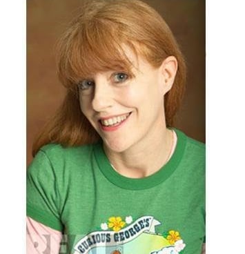 a woman with red hair and a green shirt