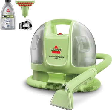 a little green vacuum cleaner with a bottle of cleaner