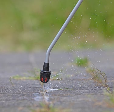 a person using a hose to clean a hose