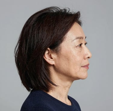 A happy customer smiling while reviewing a project on a laptop.