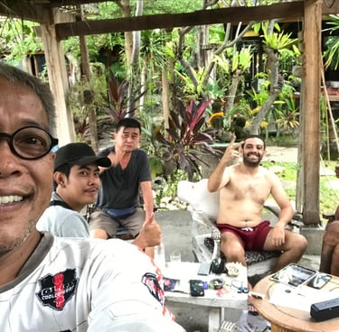 a man with glasses and a white shirt is taking a selfie