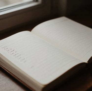 Close-up of analytical notes hand-written in a leather ledger, moody natural light from a side window, high contrast, desaturated warm tones