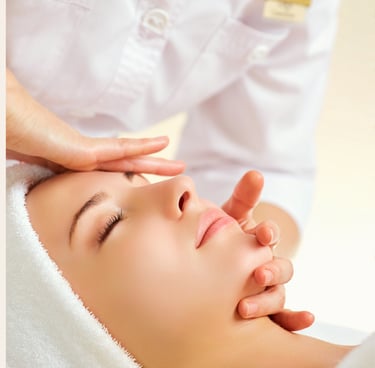 A woman receiving a professional facial massage at a luxury skin care spa center.