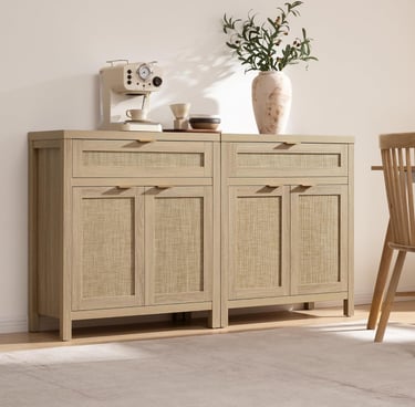 Modern light wood sideboard with woven rattan doors and a coffee maker on top.