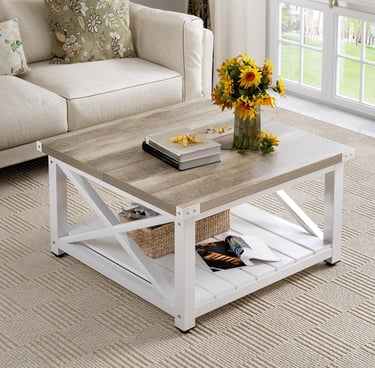 Rustic farmhouse square coffee table with white x-frame base and oak wood top in a cozy living room.
