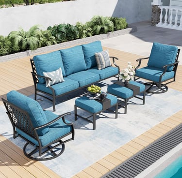 Modern 6-piece outdoor patio furniture set with blue cushions, metal sofa, and swivel chairs by a pool.