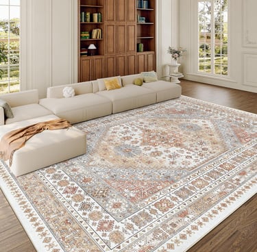 Large vintage-style area rug with intricate beige and terracotta patterns in a bright modern living room.