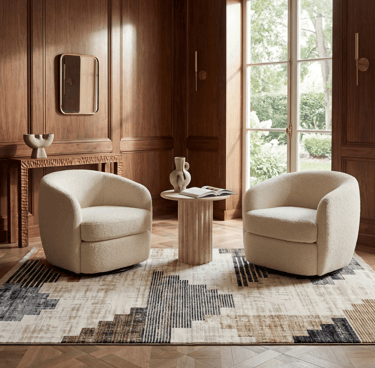 Two cream bouclé swivel chairs on a geometric rug in a luxury mid-century modern wood paneled living room.