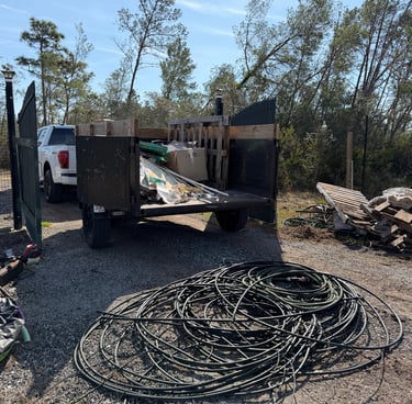 Junk removal dump trailer loaded with construction debris in Deltona, FL by SunWave Junk Removal