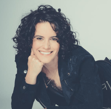 a woman with a black jacket and a backpack