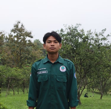 a man in a green uniform standing in a field