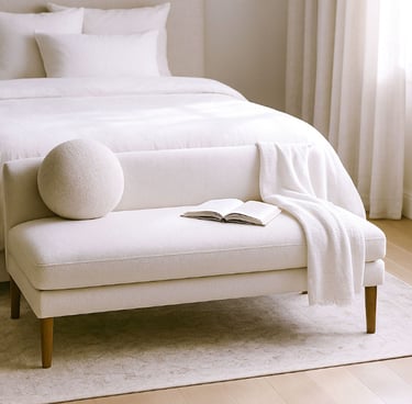 Compact linen settee in a cozy reading corner with natural shadows, a book, and a warm light atmosphere.