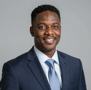 A smiling professional man in a modern office setting, representing James Walker.