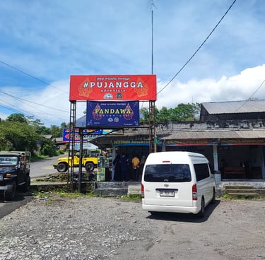 a van parked in front of a Pandawa Adventure basecamp jeep Merapi