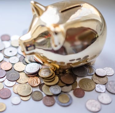 golden piggy bank and coins representing savings and saving money for financial goals and retirement