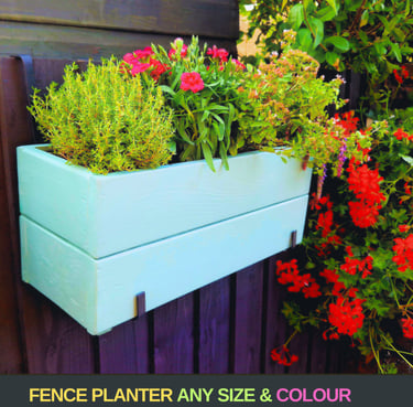 handmade planter box painted in blue with flowers and herbs