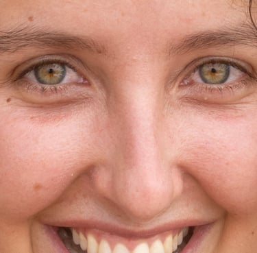 a woman with curly hair and earrings on her head
