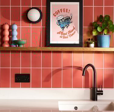 Glossy coral wall tiles with white grout in a modern kitchen splashback, featuring pastel pink