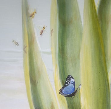 Detail of a mural showing an agave plant with a blue butterfly and bees.