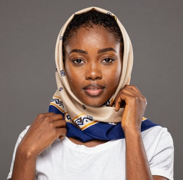 Smiling woman volunteering at a community event, wearing an impactbridge t-shirt.