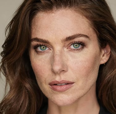 A smiling middle-aged man wearing ankle braces while walking in a park on a sunny day.