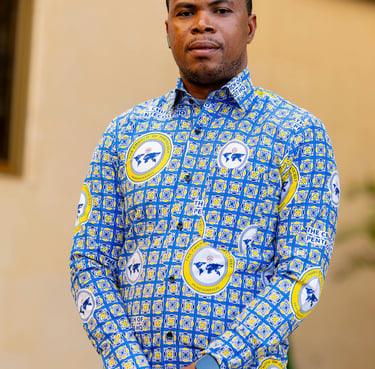 a man in a blue shirt and tan pants