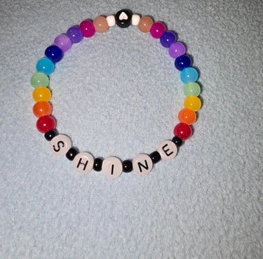 You will "SHINE" while wearing this beautiful rainbow colored bracelet with the word "Shine" on it. 