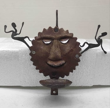 "Handcrafted iron oil lamp with sun face and two tribal figures-for export markets"