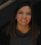 a woman in a polka dot dress smiling
