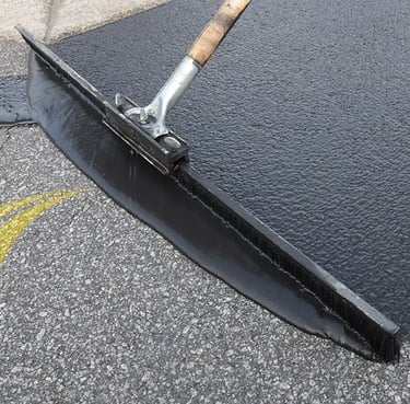Sealcoating driveway with hand broom